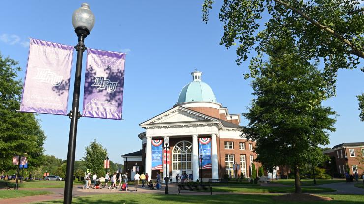 Outside view of Vann Hall, home of GS East office, and picture of banner